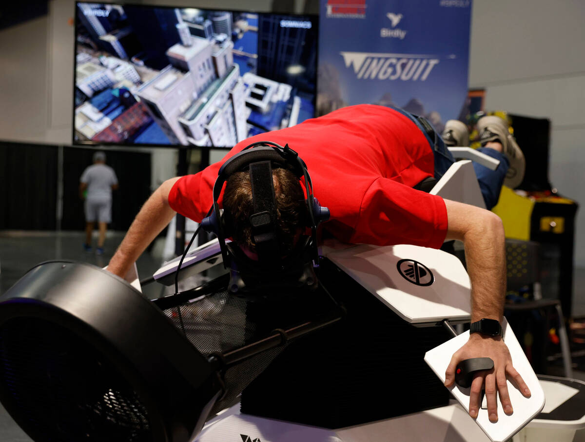 Rob Thomas, of Denver, tries out Birdly Wingsuit, a VR platform with multiple experiences, manu ...