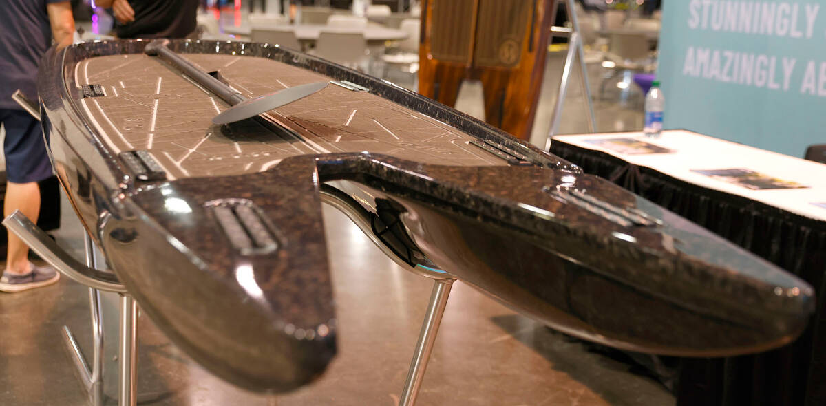Live's Watersports LX Tunnel Hull paddleboard is displayed at Big Boys Toys Innovation and Luxu ...
