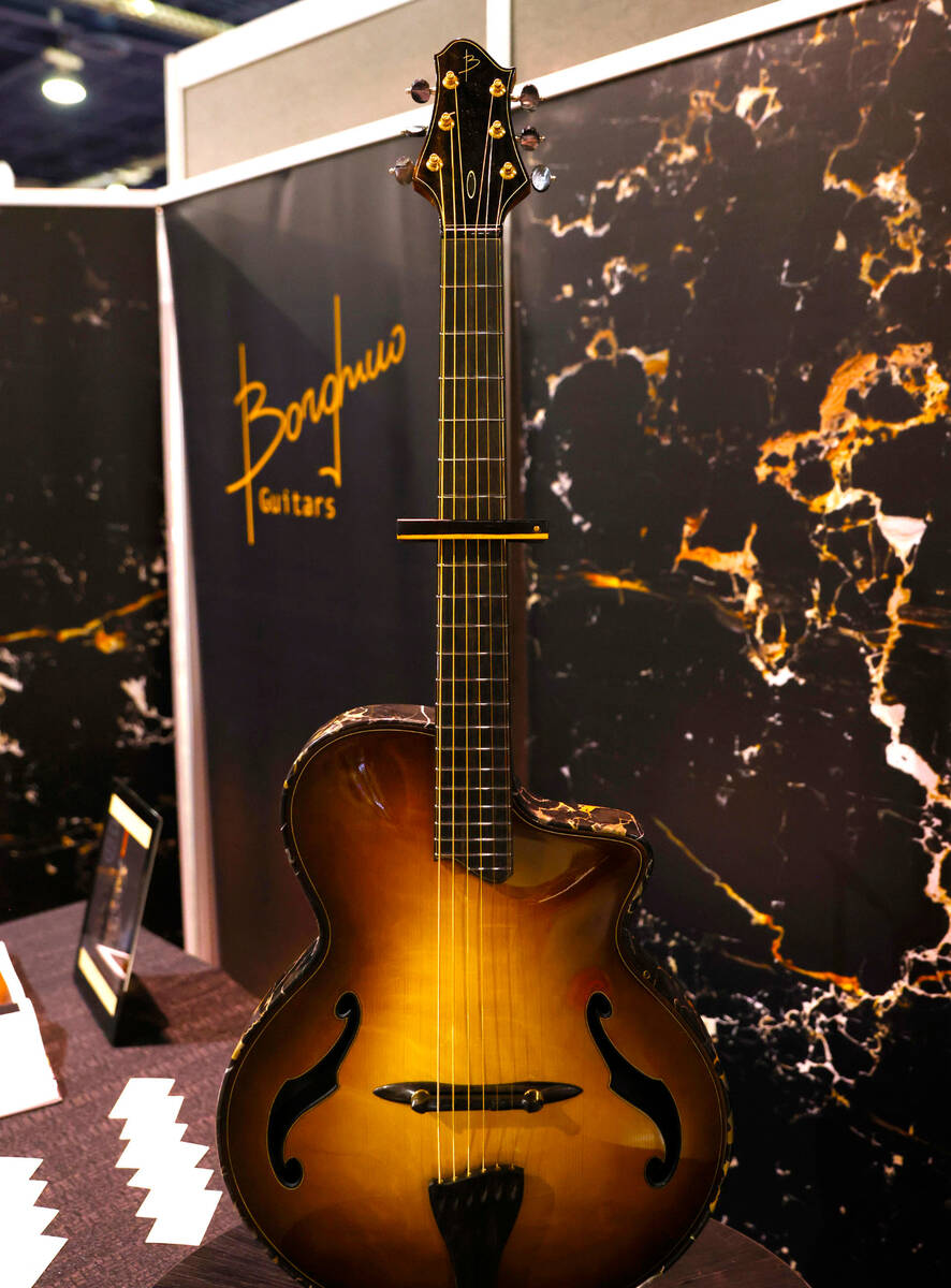 A guitar made by Italian guitar maker Mitko Borghino is displayed at Big Boys Toys Innovation a ...