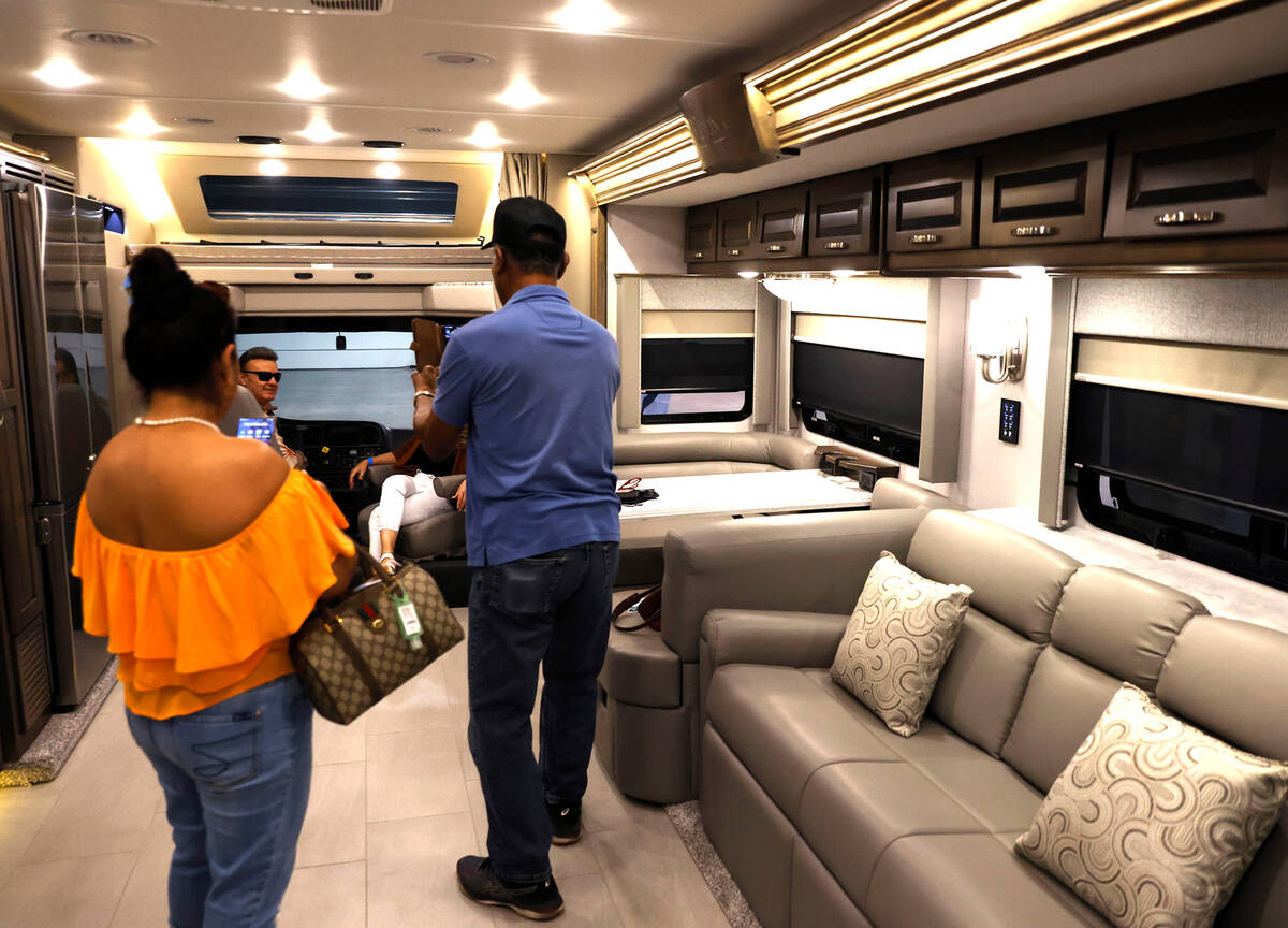 Expogoers check out a Renegade RV model LE at Big Boys Toys Innovation and Luxury Lifestyle Exp ...