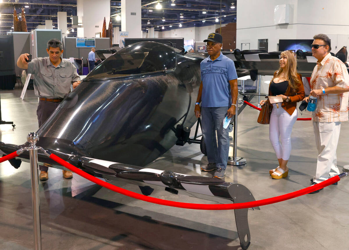 Expogoers check out BlackFly V3, an electric personal aerial vehicle, during Big Boys Toys Inno ...