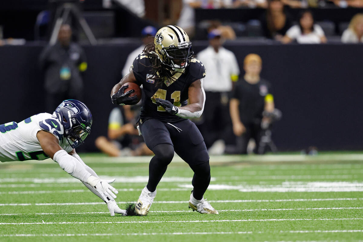 New Orleans Saints running back Alvin Kamara (41) runs the ball during an NFL football game aga ...