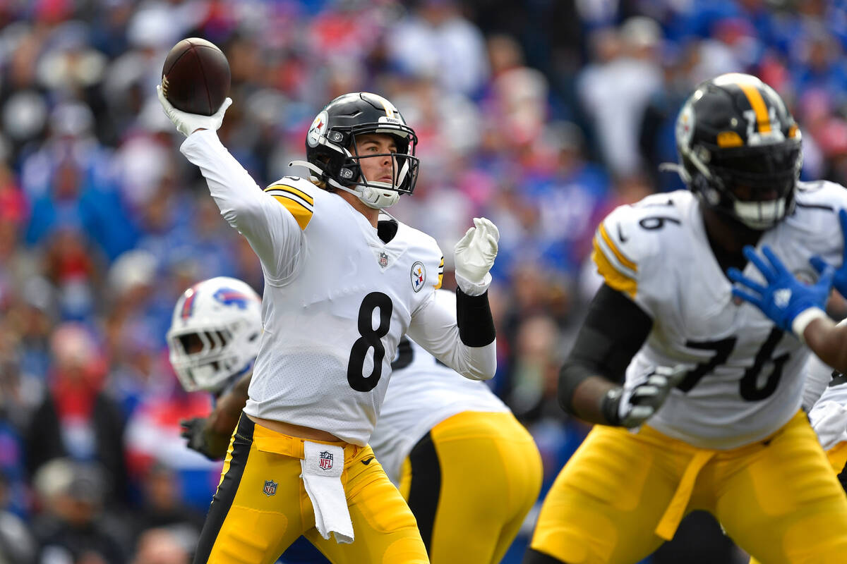 Pittsburgh Steelers quarterback Kenny Pickett (8) throws a pass during the first half of an NFL ...