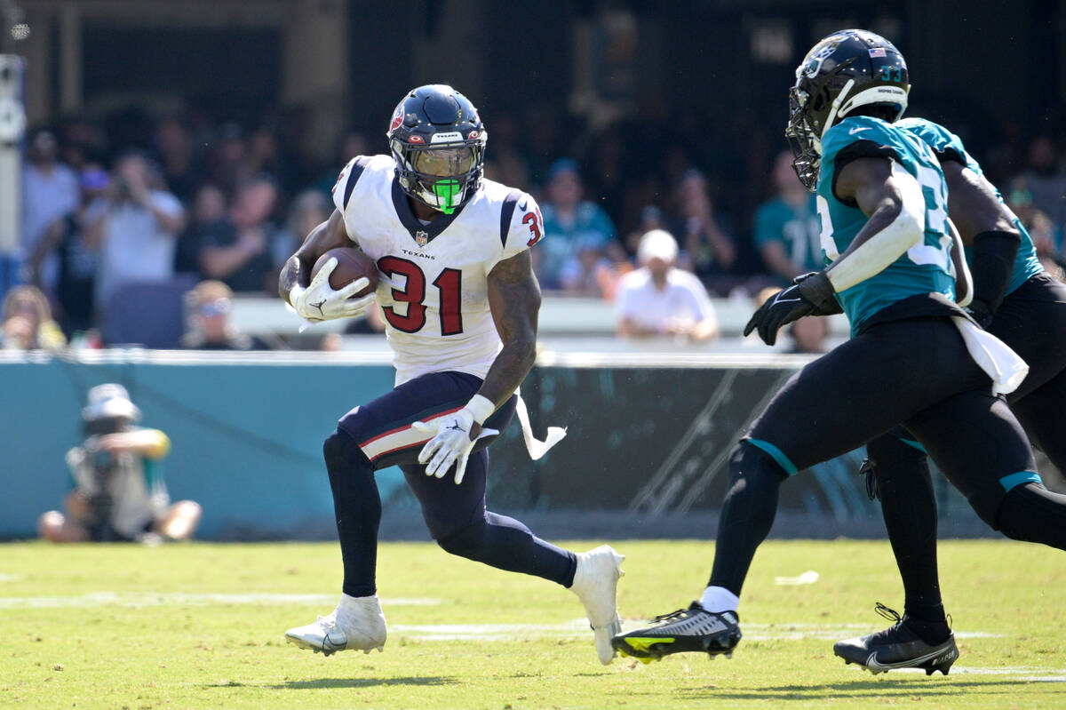 Houston Texans running back Dameon Pierce (31) rushes for yardage during the second half of an ...