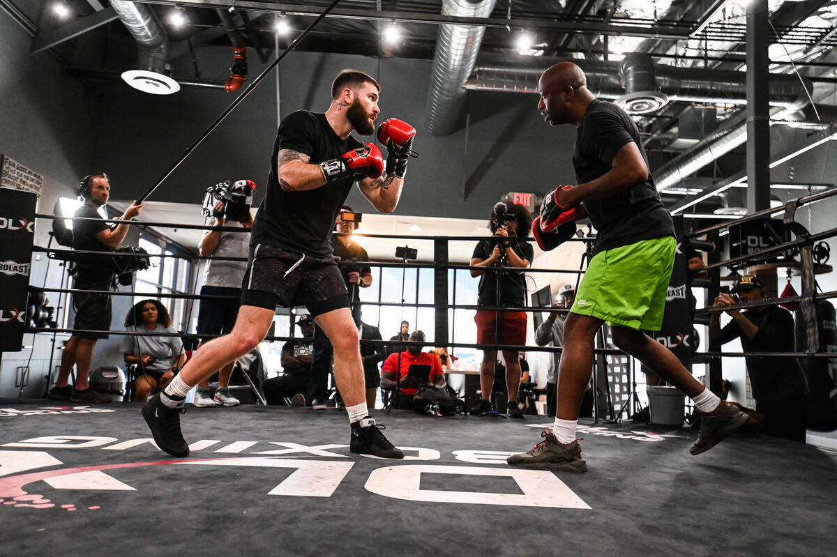 Caleb Plant works with trainer Stephen Edwards during his media day workout while his wife, Jor ...