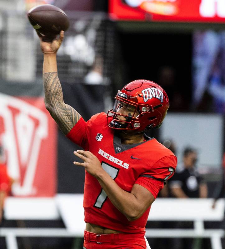 UNLV Rebels quarterback Cameron Friel (7) throws the ball as he warms up before an NCAA footbal ...