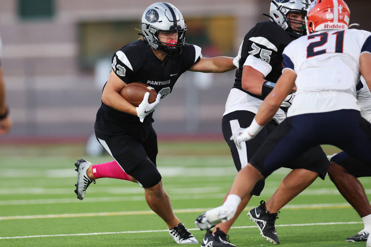 Palo Verde's Balir Thayer (23) runs the ball during the first half of a football game against B ...