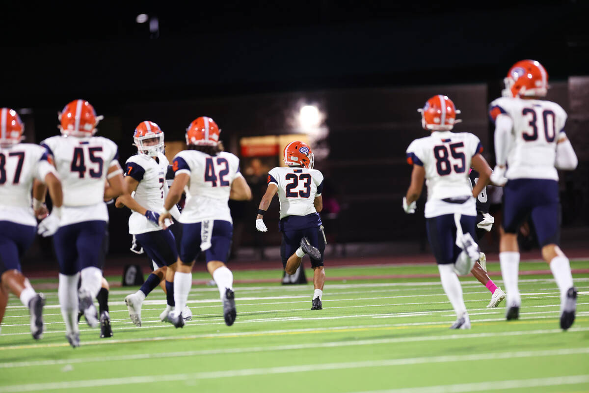 Bishop Gorman's Trech Kekahuna (23) returns a kickoff for a touchdown during the first half of ...