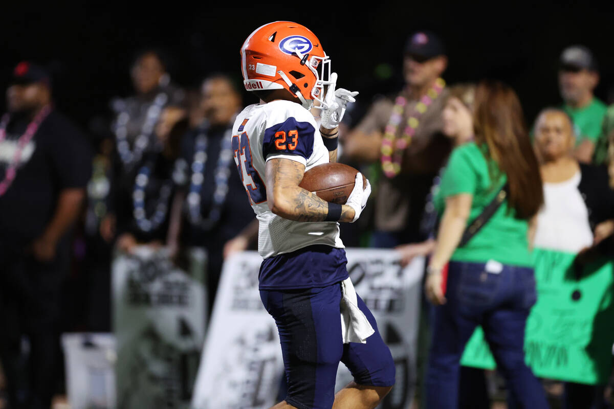 Bishop Gorman's Trech Kekahuna (23) celebrates a touchdown catch during the first half of a foo ...