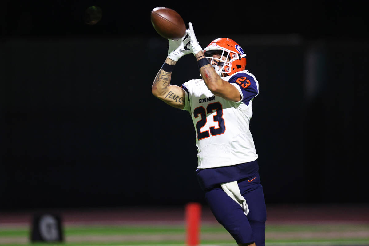 Bishop Gorman's Trech Kekahuna (23) makes a catch before running the ball for a touchdown durin ...