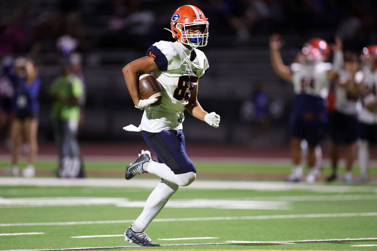 Bishop Gorman's Brandon Gaea (85) runs the ball for a touchdown after a catch during the second ...