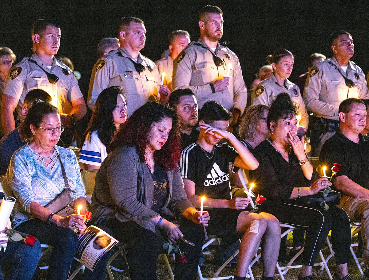 People and Las Vegas police officers gathered during a candlelight vigil for fallen officer Tru ...