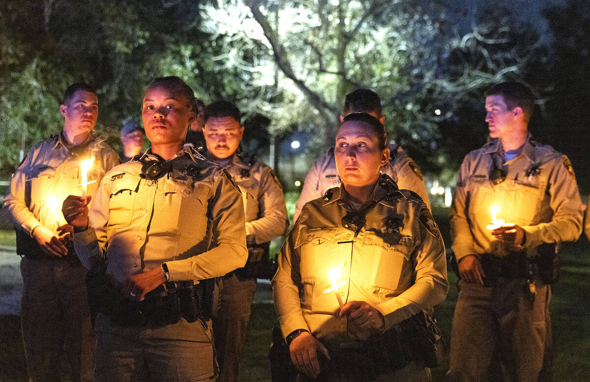 Las Vegas police officers gathered during a candlelight vigil for fallen officer Truong Thai, o ...