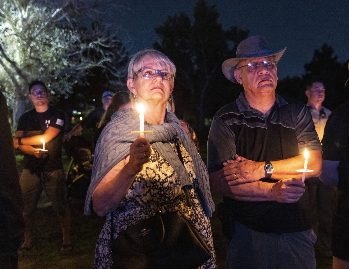 People gathered during a candlelight vigil for fallen Las Vegas police officer Truong Thai, on, ...