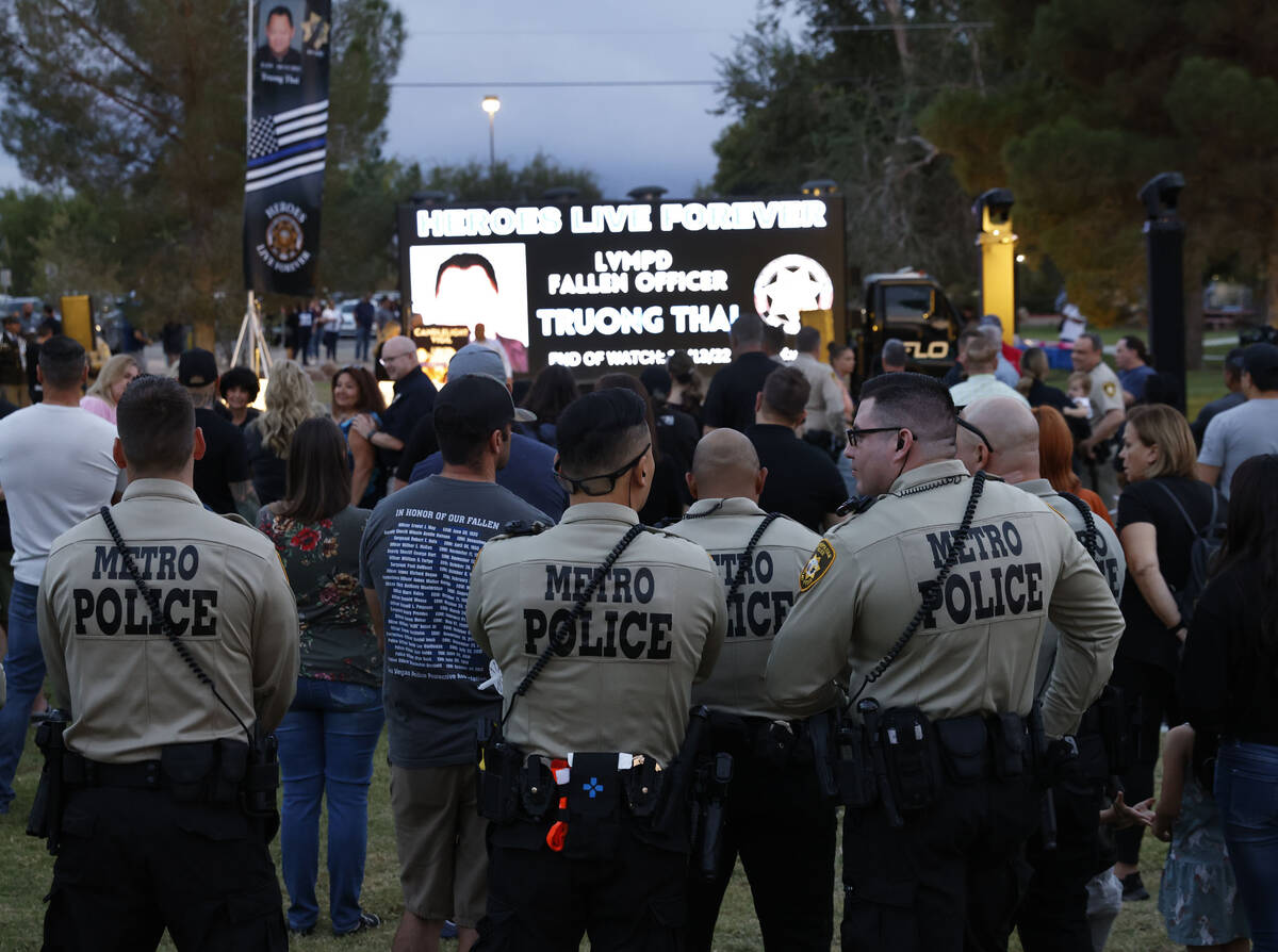 Las Vegas police officers gathered during a candlelight vigil for fallen Las Vegas officer Truo ...