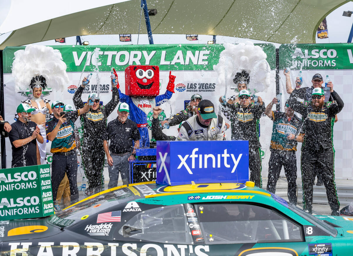 Josh Berry is showered in water by his crew after winning the Alsco Uniforms 302 NASCAR Xfinity ...