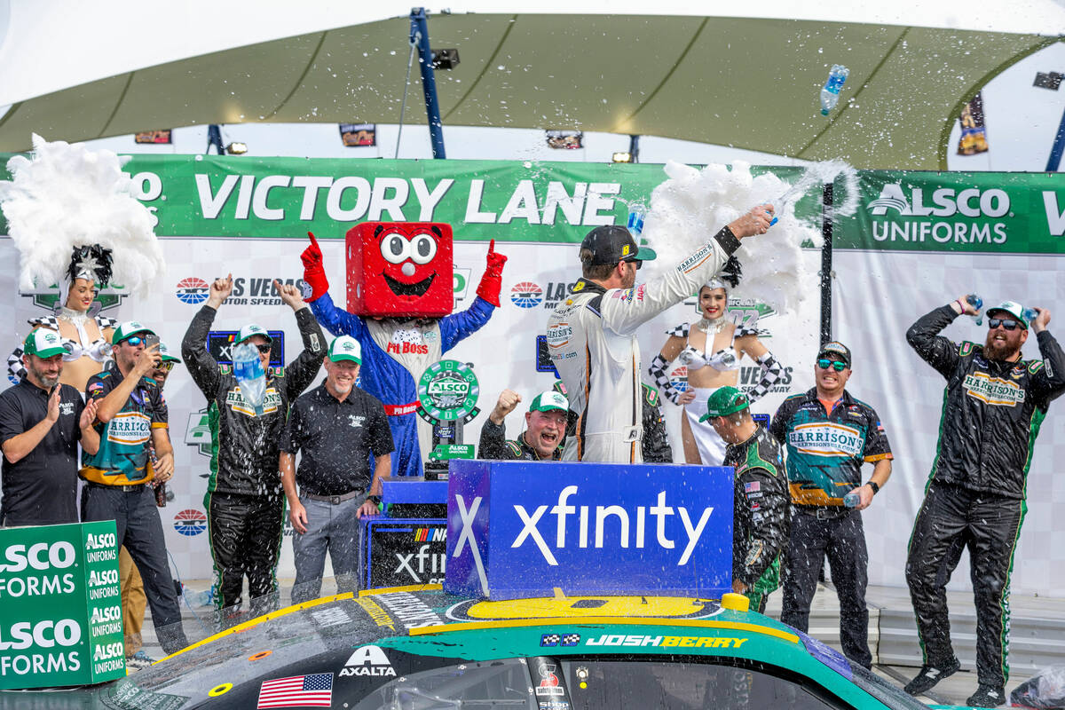 Josh Berry is showered in water by his crew after winning the Alsco Uniforms 302 NASCAR Xfinity ...