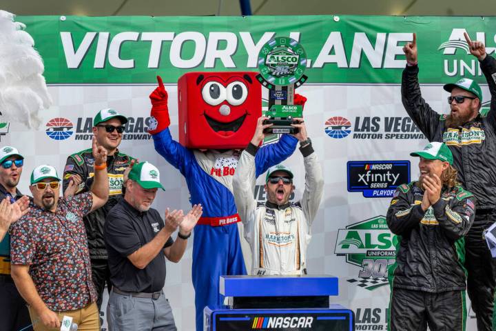 Josh Berry holds his trophy after winning the Alsco Uniforms 302 NASCAR Xfinity Series Playoff ...