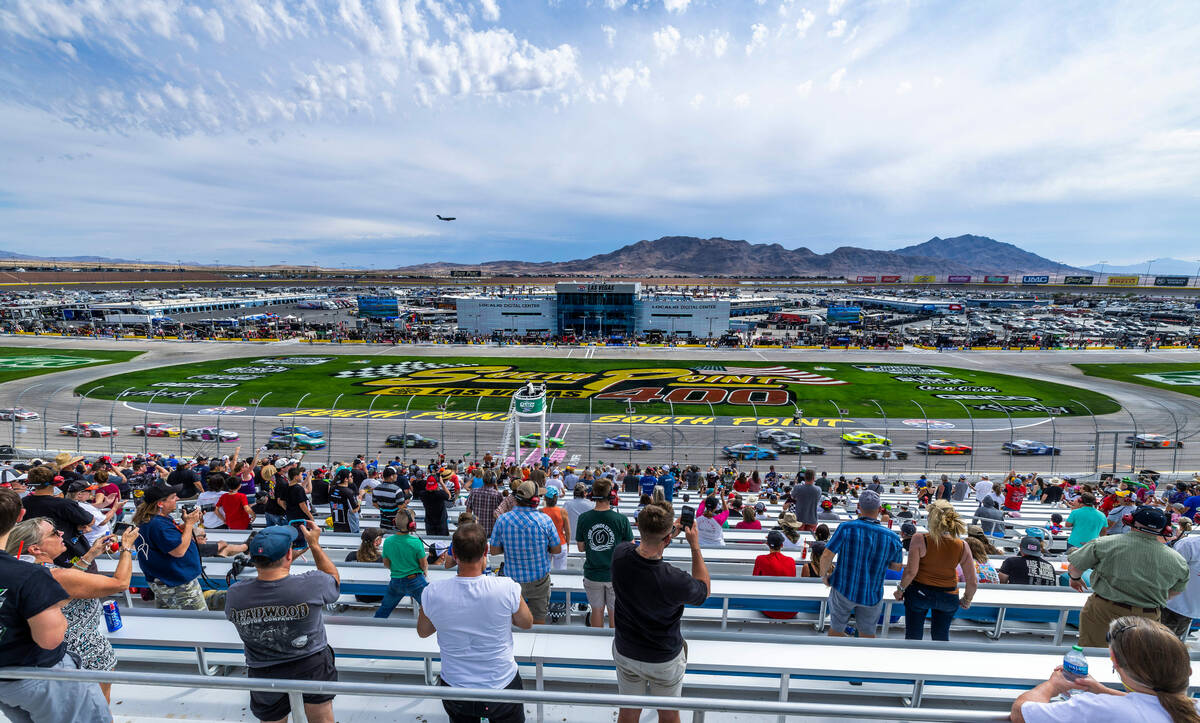 Fans cheer on the drivers during the Alsco Uniforms 302 NASCAR Xfinity Series Playoff Race at t ...