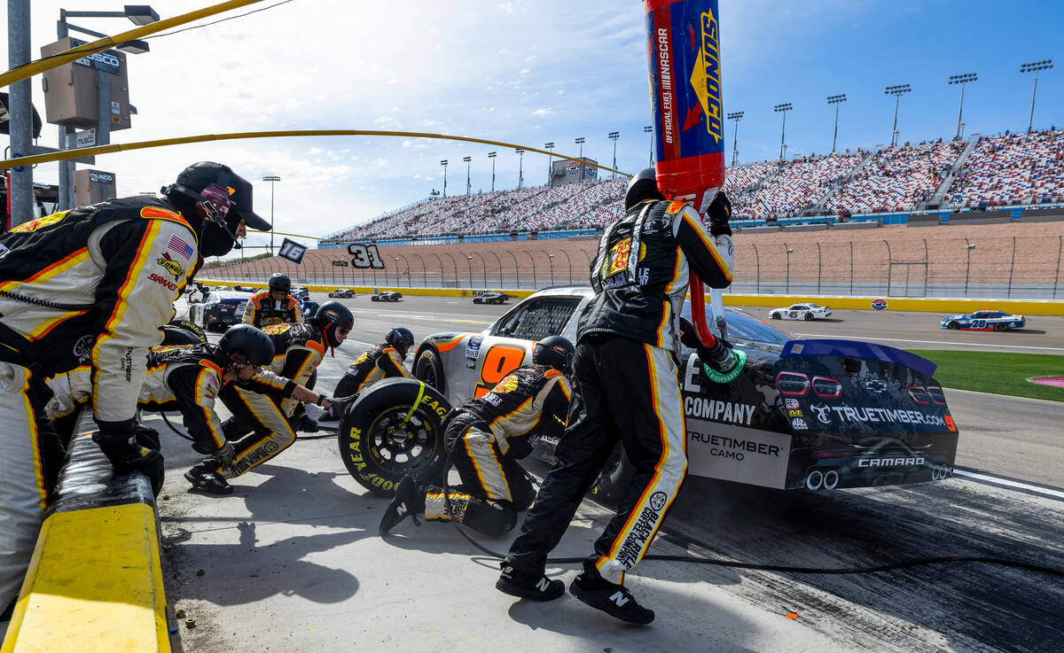 Noah Gragson (9) has his car attended to by his pit crew during the Alsco Uniforms 302 NASCAR X ...