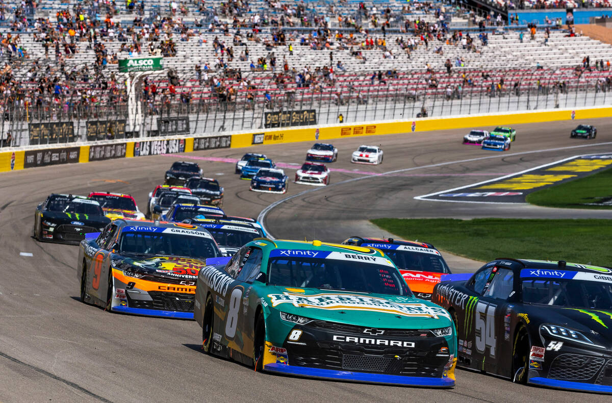Josh Berry (8) races beside Ty Gibbs (54) and ahead of Noah Gragson (9) during the Alsco Unifor ...