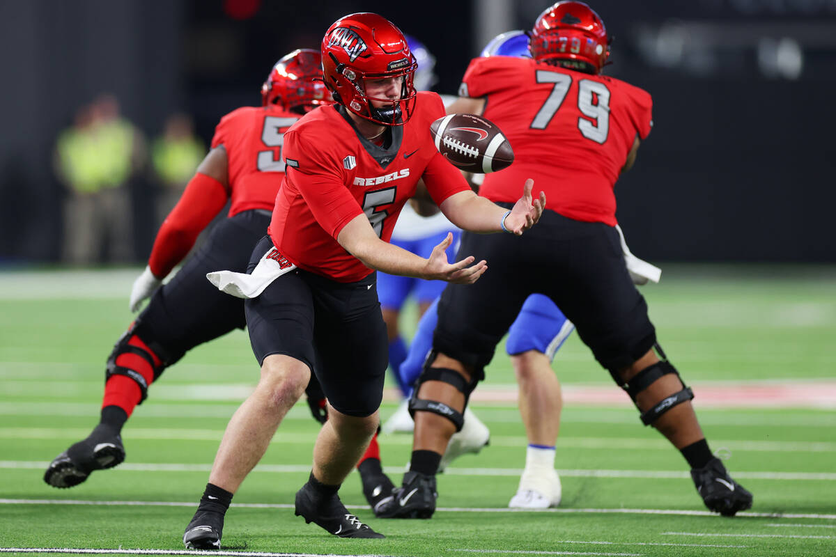UNLV Rebels quarterback Harrison Bailey (5) fumbles the ball before throwing a pass during the ...