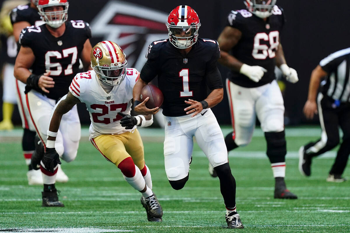 Atlanta Falcons quarterback Marcus Mariota (1) runs against San Francisco 49ers cornerback Dont ...