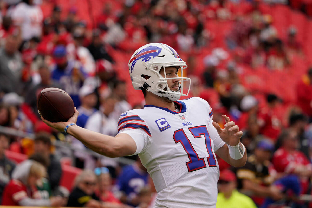Buffalo Bills quarterback Josh Allen warms up before the start of an NFL football game between ...