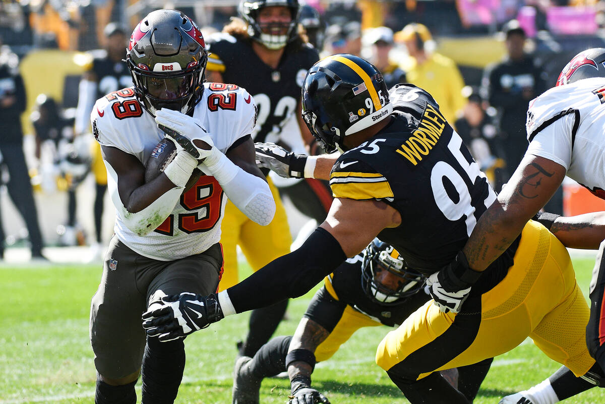 Tampa Bay Buccaneers running back Rachaad White (29) is tacked by Pittsburgh Steelers defensive ...