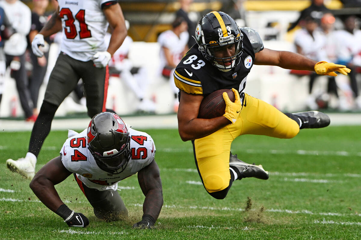 Pittsburgh Steelers tight end Connor Heyward (83) is upended by Tampa Bay Buccaneers linebacker ...