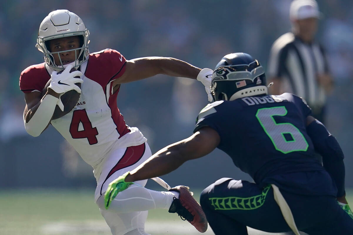 Arizona Cardinals wide receiver Rondale Moore (4) runs against Seattle Seahawks safety Quandre ...