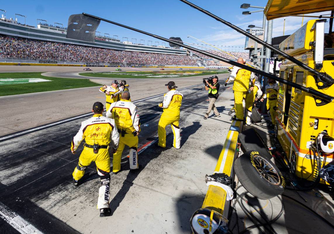 Members of driver Joey Logano’s pit crew celebrate as he wins the South Point 400 NASCAR ...