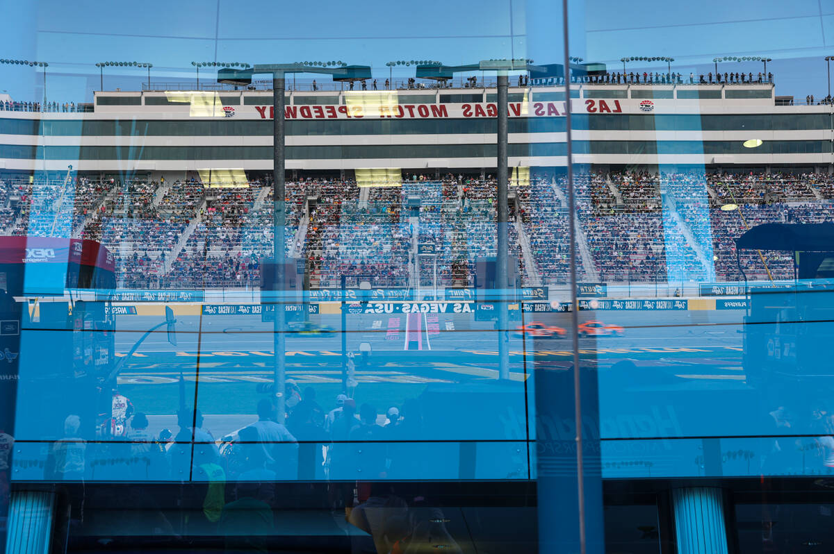 Grandstands and the track are reflected during the South Point 400 NASCAR Cup Series playoff ra ...