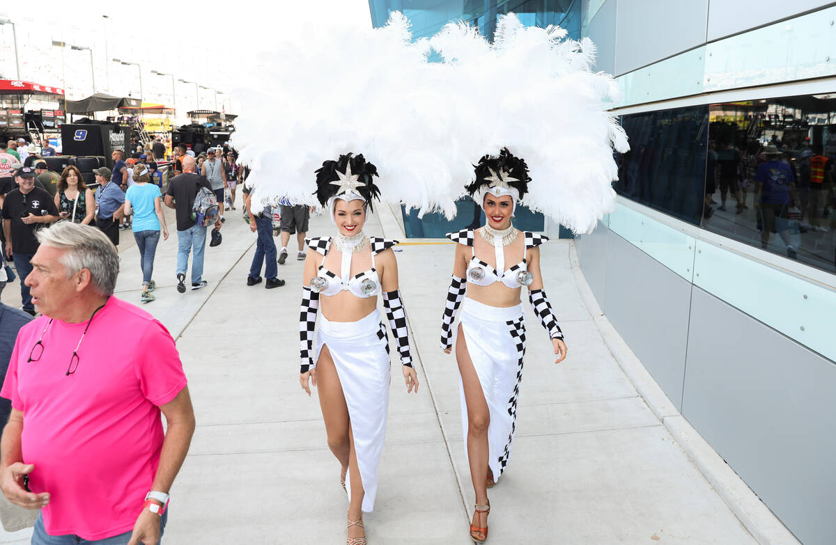 Showgirls walk towards pit road before the NASCAR Cup Series playoff race at Las Vegas Motor Sp ...