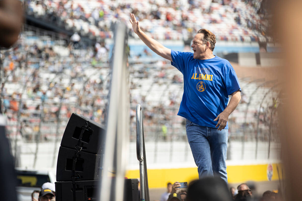 Actor Vince Vaughn, honorary race official, greets the crowd before the South Point 400 NASCAR ...
