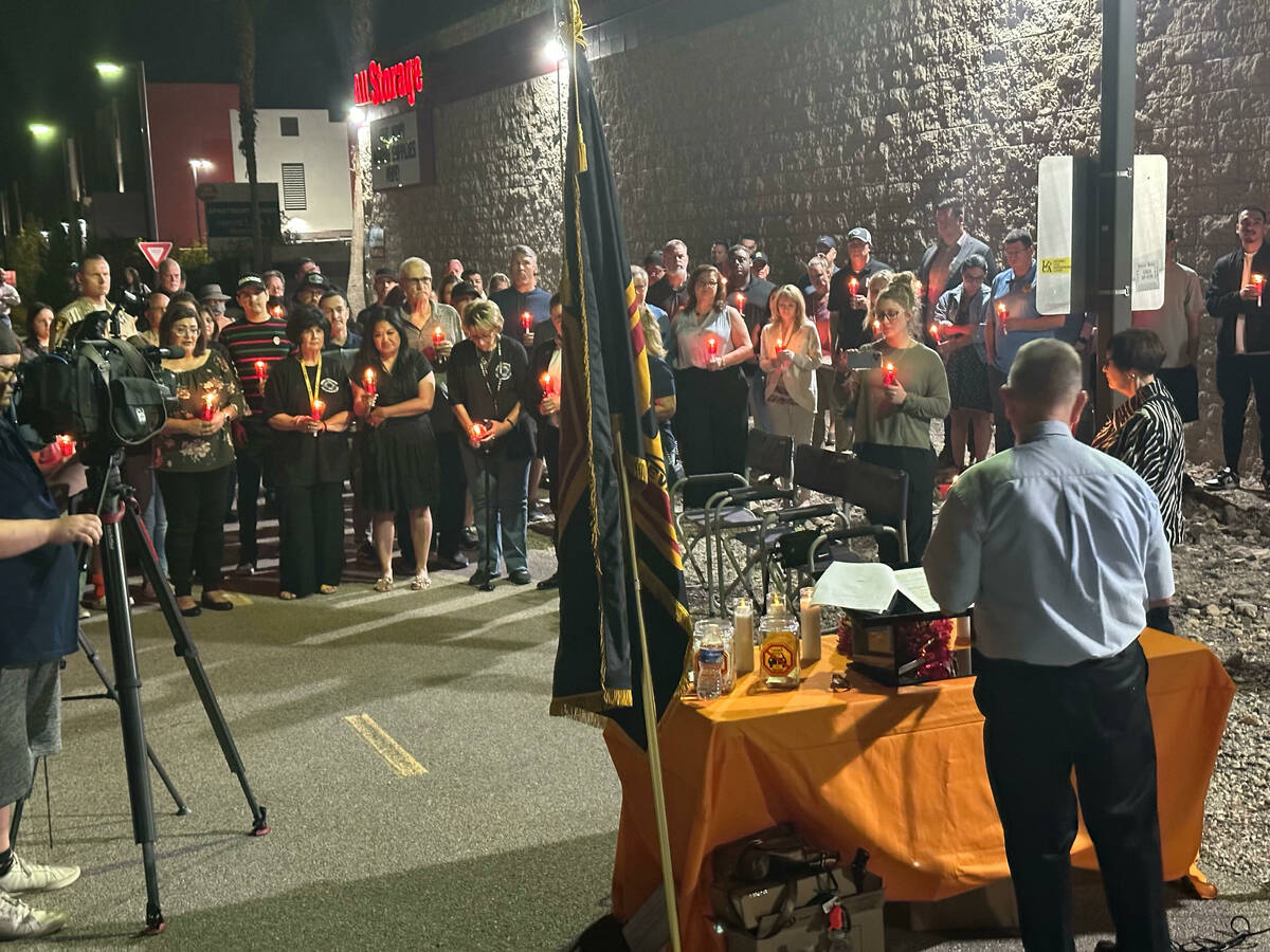 A candlelight vigil Sunday, Oct. 16, 2022, for critically injured first responder Mark Vobis ne ...
