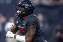 UNLV Rebels defensive lineman Adam Plant Jr. (7) is pumped after another defensive stop of the ...