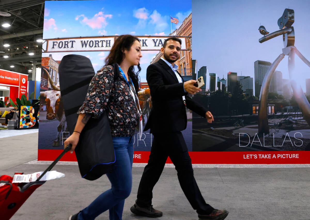 Forumgoers arrive at the 27th World Route Development Forum at the Las Vegas Convention Center, ...