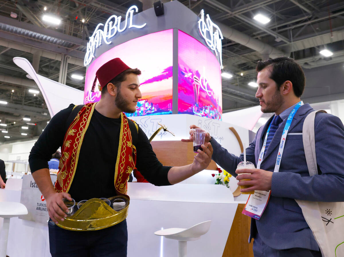 Abdul Alokla serves Turkish Sherbet, a natural homemade juice, to Abelardo Martin at Istanbul A ...