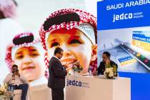 Forumgoers take a break at Jaddah, Saudi Arabia, Airport booth is seen during the 27th World Ro ...