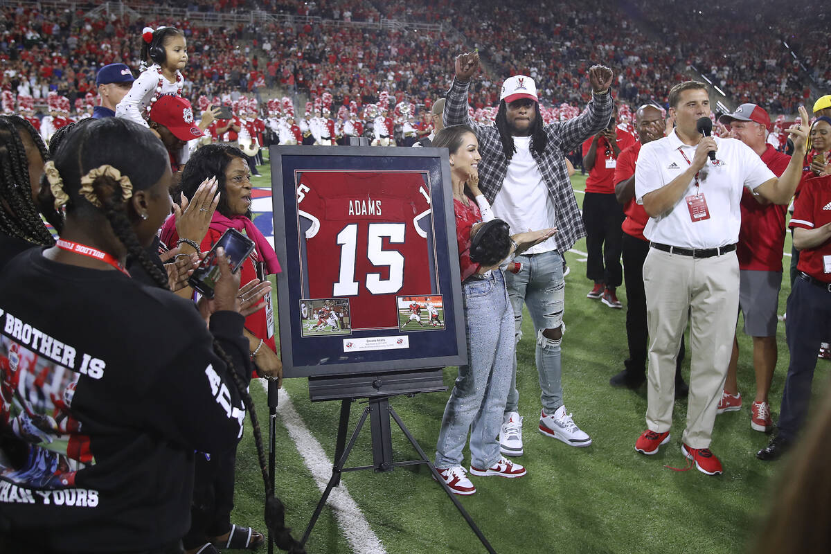 Las Vegas Raiders' Davante Adams, a former Fresno State player, raises his hands as his jersey ...