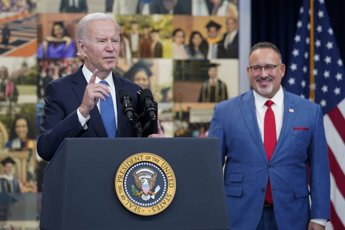 President Joe Biden speaks about the student debt relief portal beta test as Education Secretar ...
