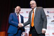 Gov. Steve Sisolak, right, and Sheriff Joseph Lombardo shake hands after meeting with the const ...