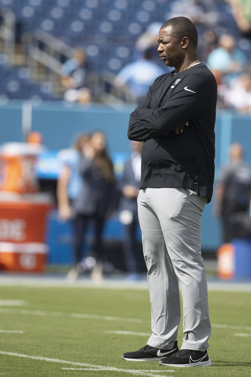 Raiders defensive coordinator Patrick Graham watches the team warm up before an NFL game agains ...