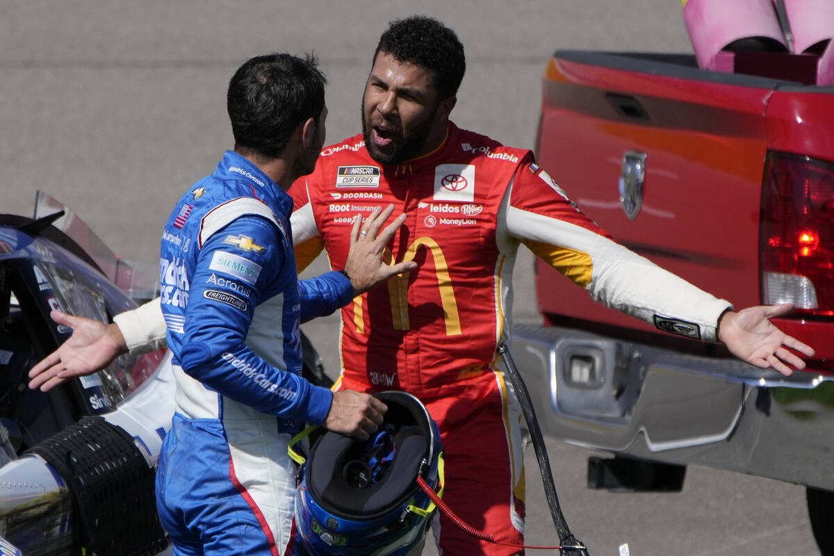 Bubba Wallace, right, argues with Kyle Larson after the two crashed during a NASCAR Cup Series ...