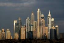 The sun reflects on skyscrapers in Dubai, United Arab Emirates, Feb. 27, 2021. (AP Photo/Kamra ...