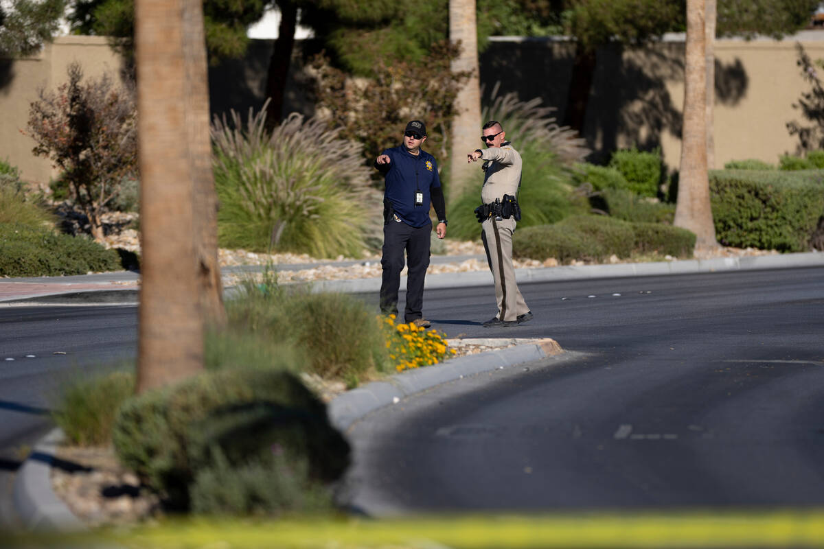 Las Vegas police officers investigate the scene of a fatal accident at the 5700 block of Centen ...