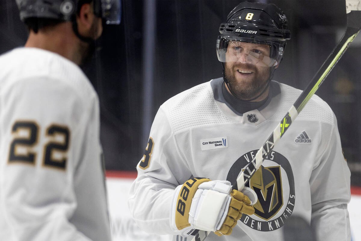 Golden Knights forward Phil Kessel, right, communicates with center Michael Amadio (22) on the ...