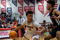 Liberty’s Dedan Thomas (11) drives around Durango’s Colton Knoll (13) during a high school ...