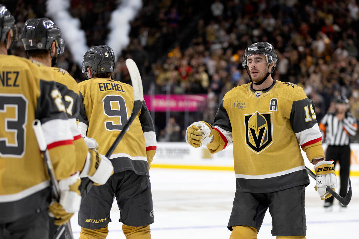 Golden Knights right wing Reilly Smith (19) skates to celebrate with teammates after Golden Kni ...